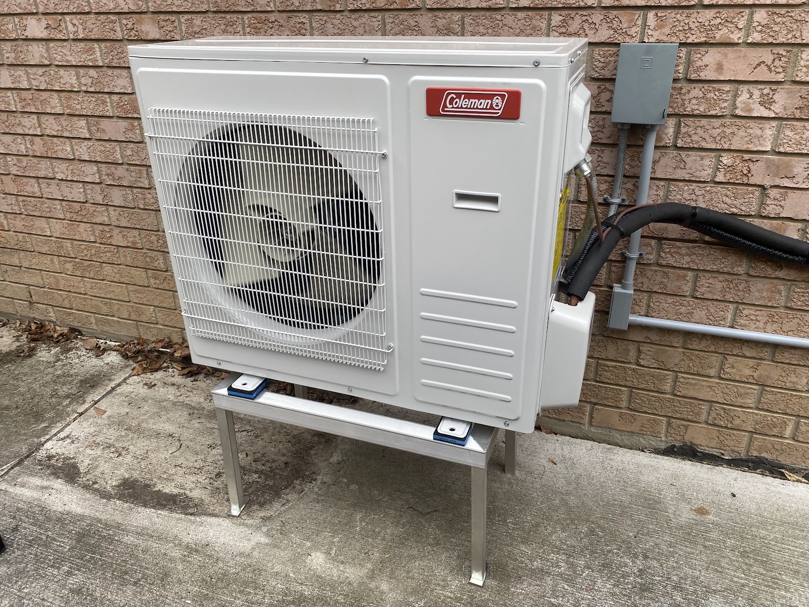 Outdoor Coleman heat pump installed by Alpha